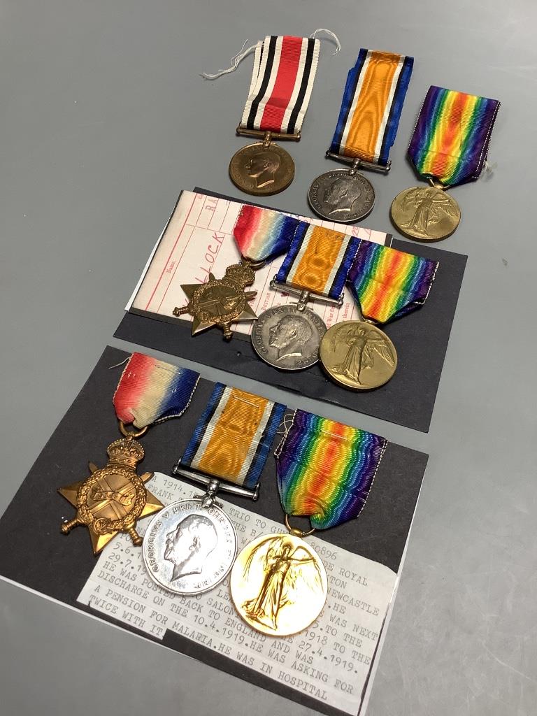 Three groups of WW1 medals